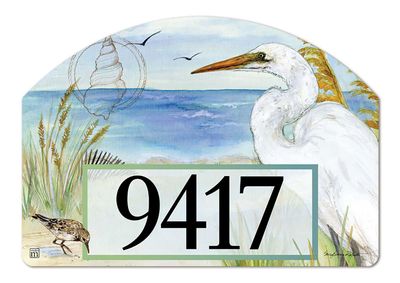 Close-up of a magnetic yard sign design showing a white egret in tall marsh grass and adhesive address numbers.