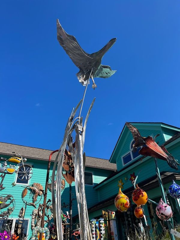 MOTHER GOOSE ROCKING GARDEN SCULPTURE STAINLESS STEEL