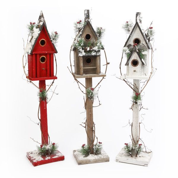 Grouping of slender 36-inch decorative wooden birdhouses featuring snowy roofs and evergreen sprigs.