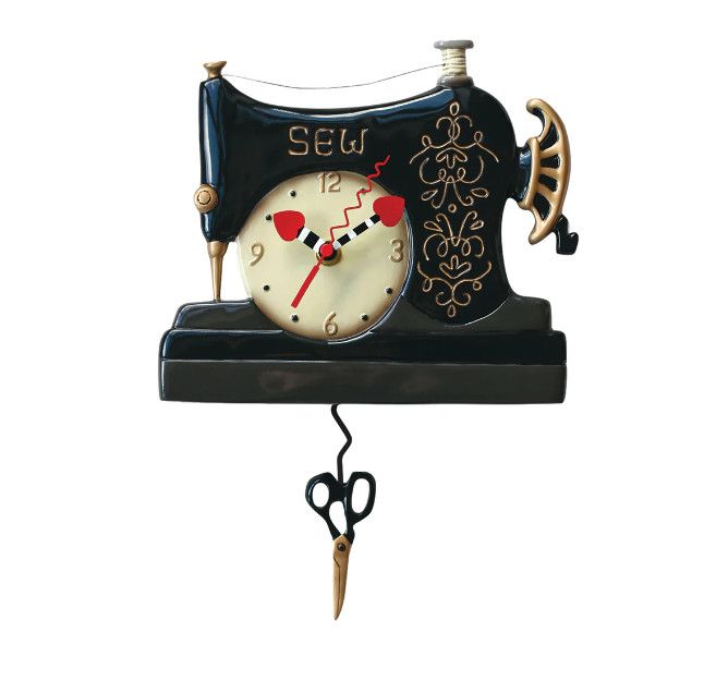 Vintage sewing machine wall clock with scissor pendulum and decorative hand-painted details.