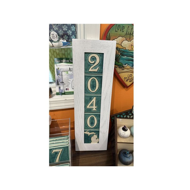 Four tile vertical house number frame displaying teal 4x4 number tiles.