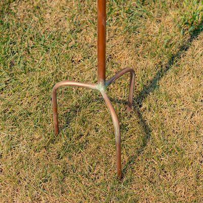 Close-up of the 4-prong iron stake base designed for stability in garden soil.