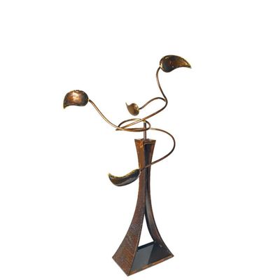 Abstract bronze kinetic sculpture with curved leaf elements on tall sculptural base.