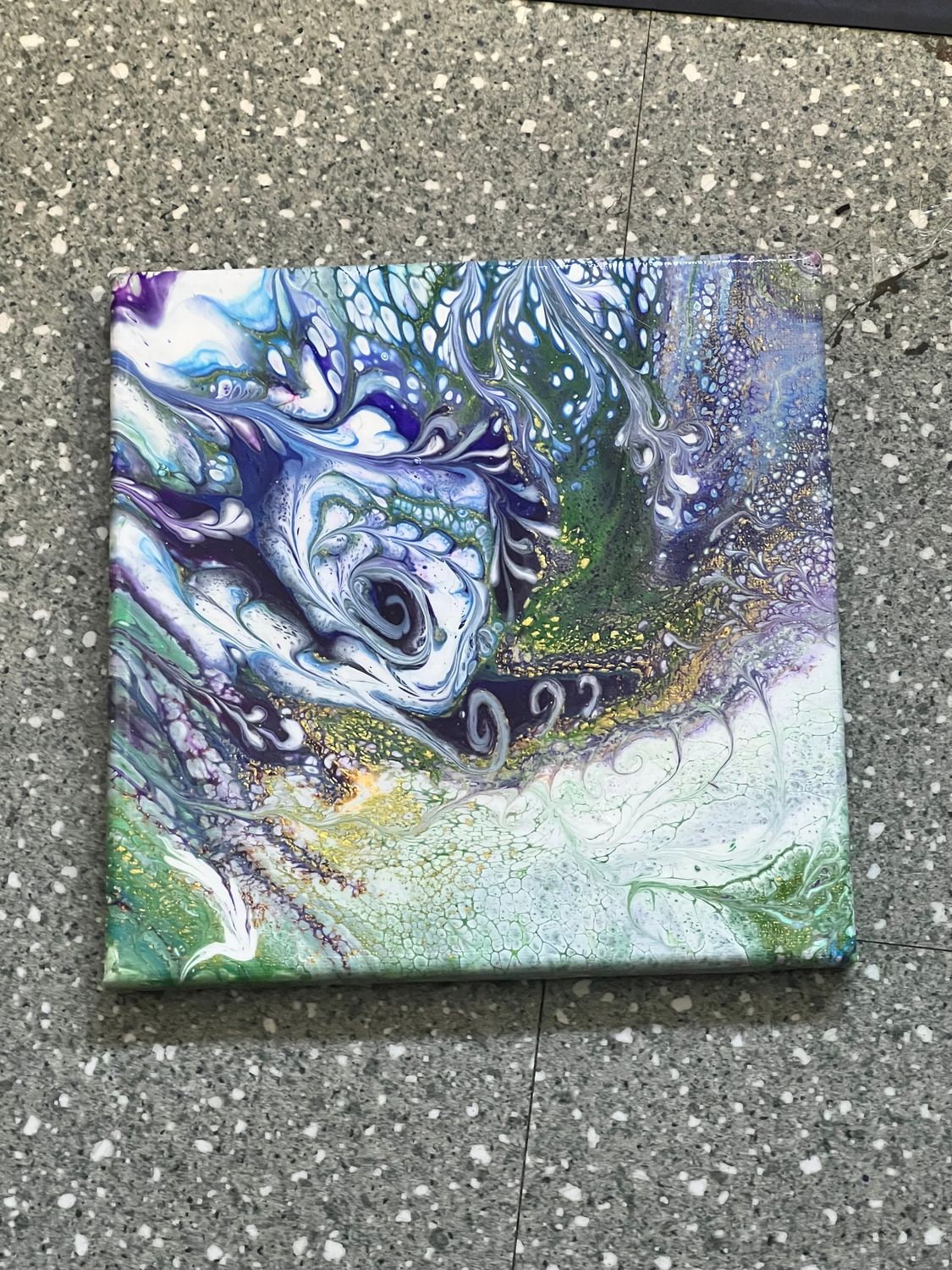 An 8x8 square artwork depicting a dramatic, swirling blue and metallic grey abstract design
