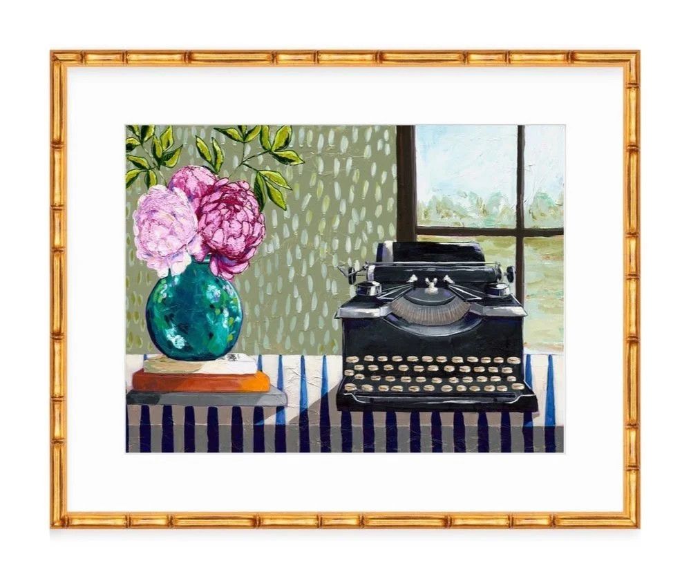 An unframed paper art print featuring a vintage black manual typewriter sitting on a striped tabletop next to a vase