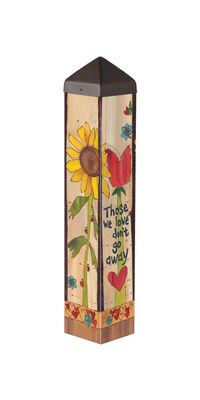 Angled view of the With Us Everyday memorial art pole featuring sunflowers and heartfelt quotes.