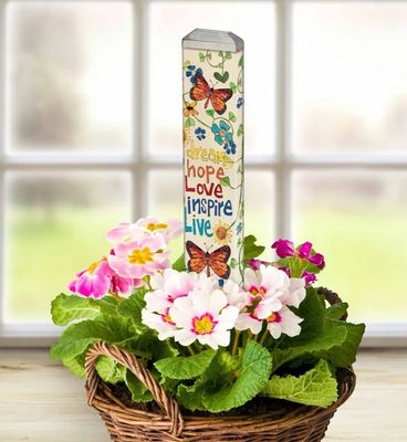 Close-up of the "Dream Hope Love Inspire Live" lettering with soft botanical colors.