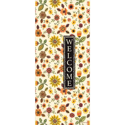 Close-up of the cream-colored background and warm orange and yellow autumn flowers.