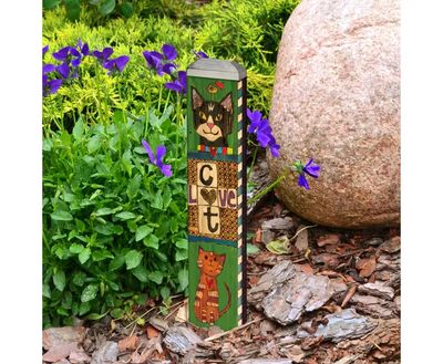 Close-up of the cat illustrations and "Lessons from My Cat" text on the decorative pole.