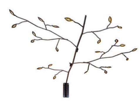 Brown metal wall art shaped like a long tree branch with small leaf accents.