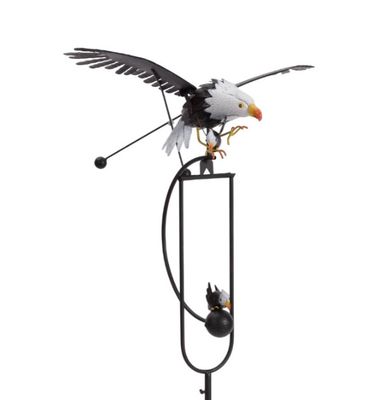 Rustic metal kinetic garden stake featuring a wind-balanced eagle with outstretched wings.