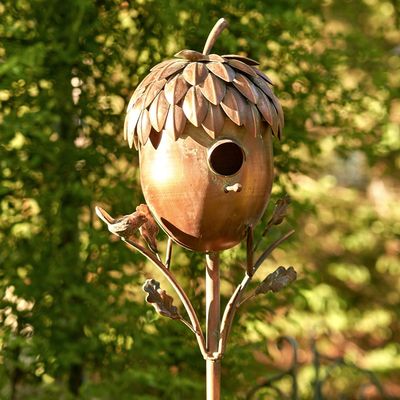 65-inch tall acorn-shaped birdhouse garden stake with a warm copper finish.