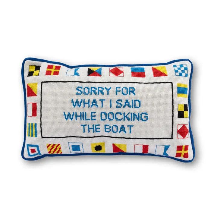 Rectangular needlepoint pillow with a colorful  border and text that reads "SORRY FOR WHAT I SAID WHILE DOCKING THE BOAT".
