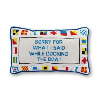 Rectangular needlepoint pillow with a colorful  border and text that reads "SORRY FOR WHAT I SAID WHILE DOCKING THE BOAT".