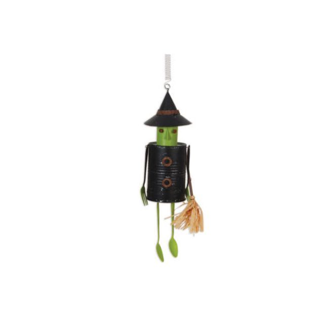 Rustic metal witch hanging decoration with spring and dangling green legs.