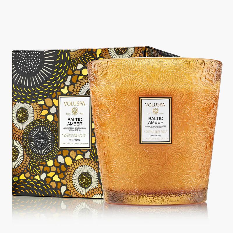 Large amber-toned glass candle with three wicks and a decorative embossed Japonica pattern.
