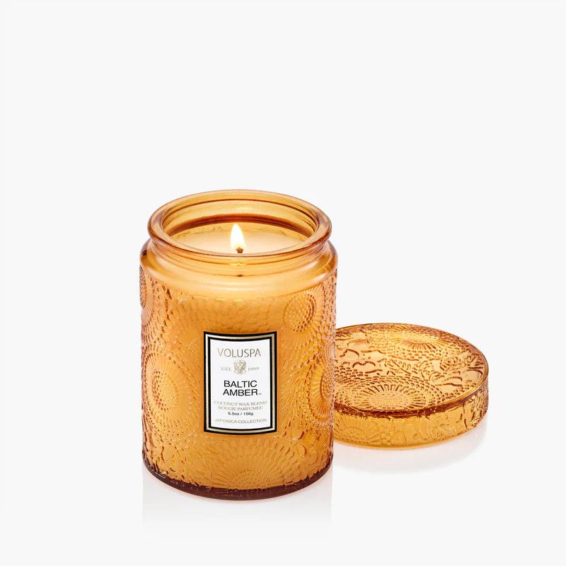 Baltic Amber Small Jar Candle in a warm amber-toned embossed glass vessel with a matching lid.