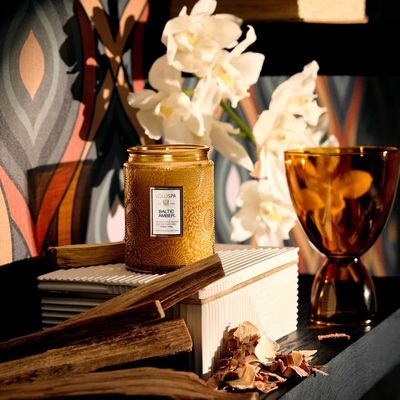 Side view of the small glass jar showcasing the intricate Japonica collection texture and gold-accented labeling.
