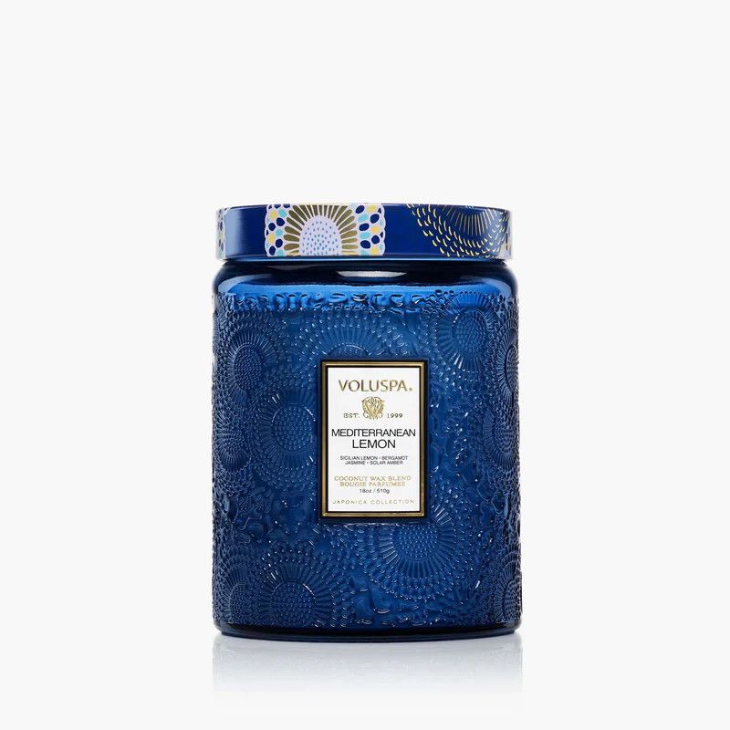 18oz Mediterranean Lemon candle in a deep blue embossed glass jar with a decorative gold metal lid.