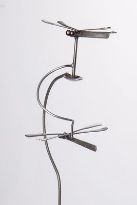 Close-up line drawing and design of the double dragonfly kinetic garden balancer crafted from silverware.