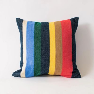 Square multi colored striped cotton throw pillow photographed on a white background.
