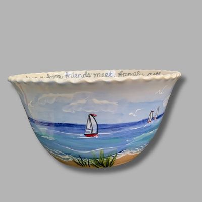 Lakeshore blessing bowl with beach scene, waves, and grassy dunes.