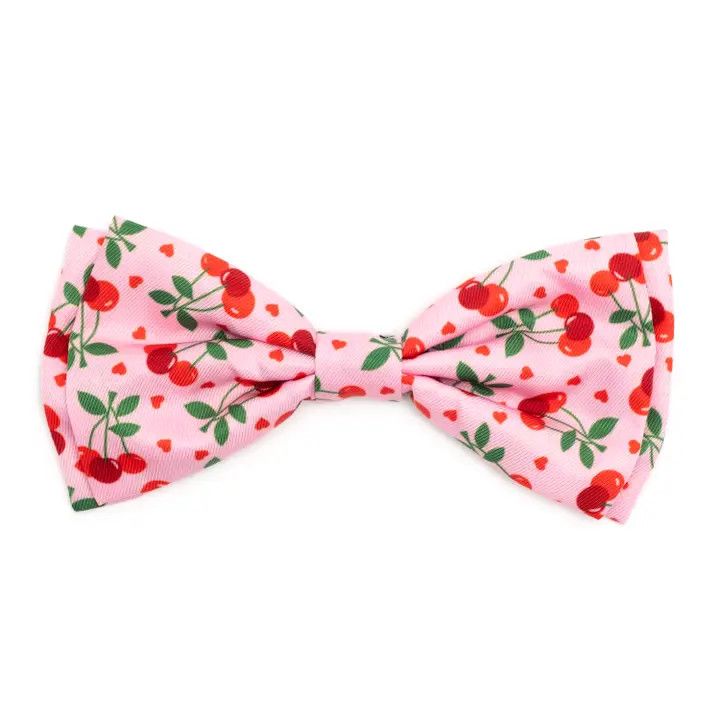 Pink pet bow tie with red cherry and heart print design.
