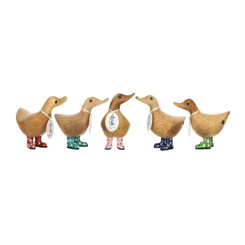 Hand-carved bamboo root wooden duck figurines wearing colorful floral rain boots in red, teal, pink, blue, and green.
