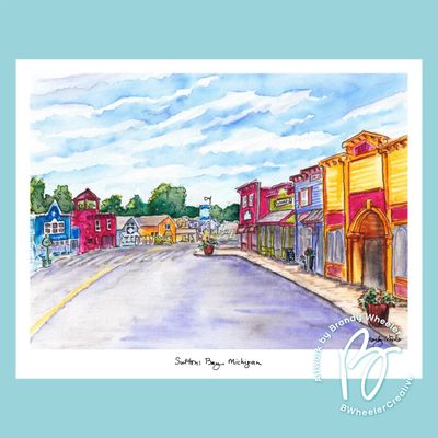 11x14 watercolor print of downtown Suttons Bay, Michigan featuring colorful storefronts and a bright blue sky by artist Brand
