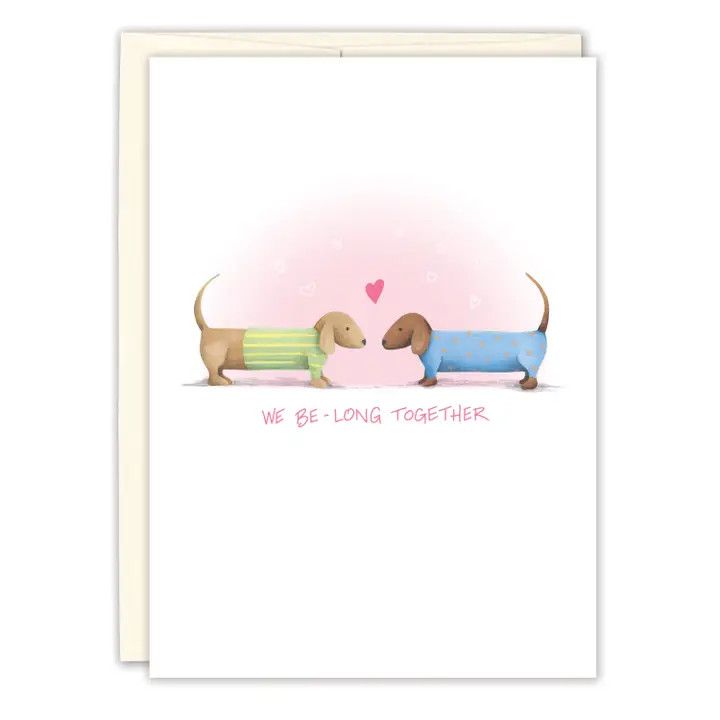 Whimsical illustration of long hound dogs on a premium A6 anniversary greeting card paired with a warm white envelope.