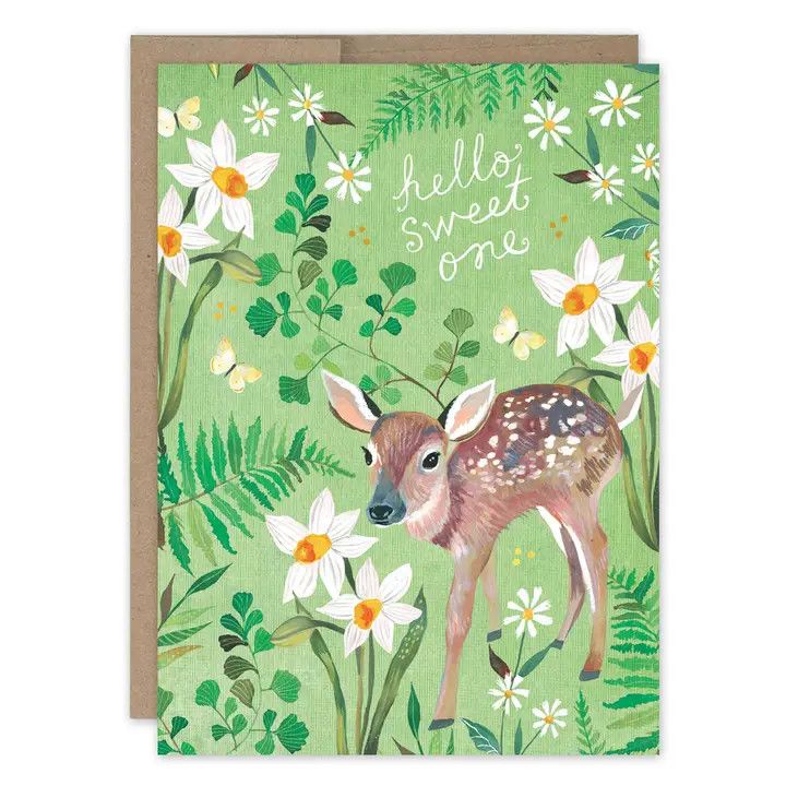 Whimsical new baby greeting card featuring an illustrated fawn design, shown next to a brown Kraft envelope