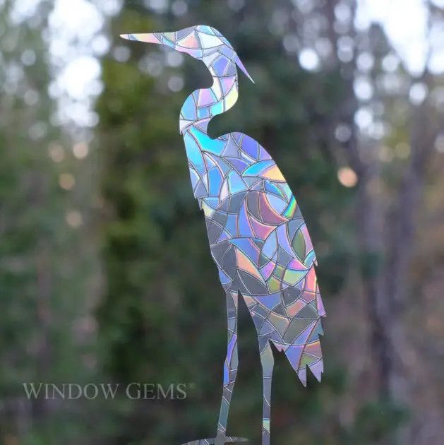 A set of prismatic window cling decals featuring  shorebirds, including a great blue heron and flying gulls