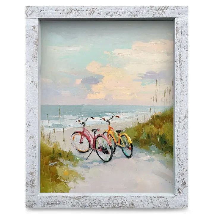 An 8x12 real wood framed paper art print depicting two vintage bicycles parked along a scenic coastal beach path
