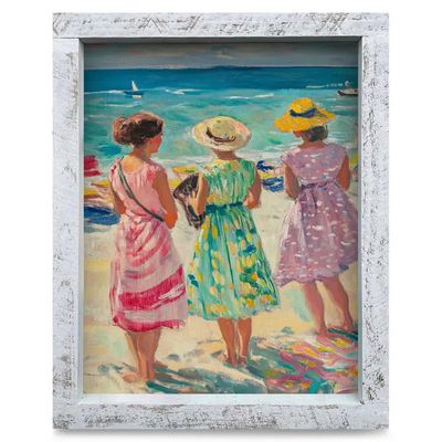 An 8x12 real wood framed paper art print depicting three colorful women relaxing on a sandy beach
