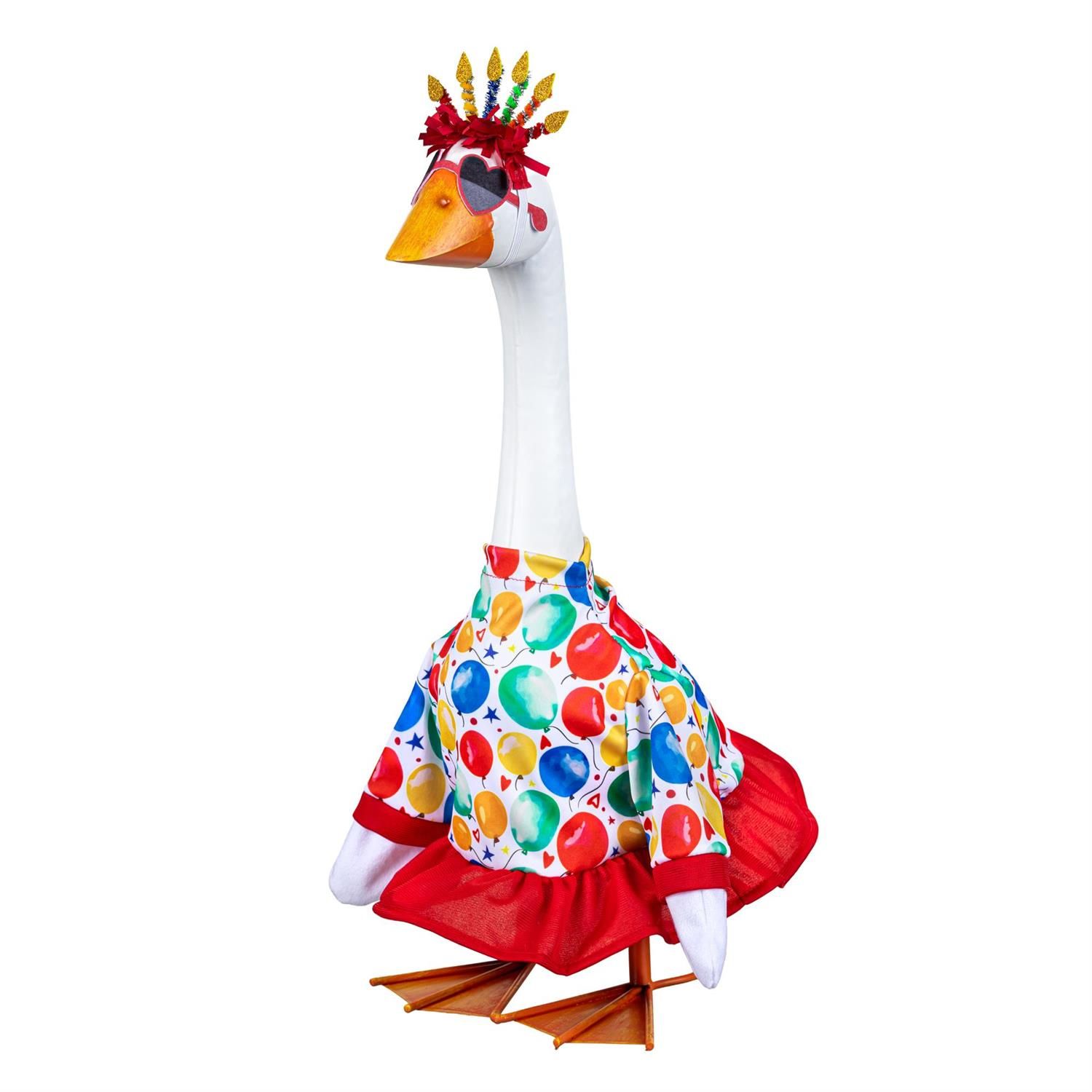 Giddy the Porch Goose modeling a balloon-print outfit with red trim and ruffles, heart-shaped glasses, and a birthday candle 