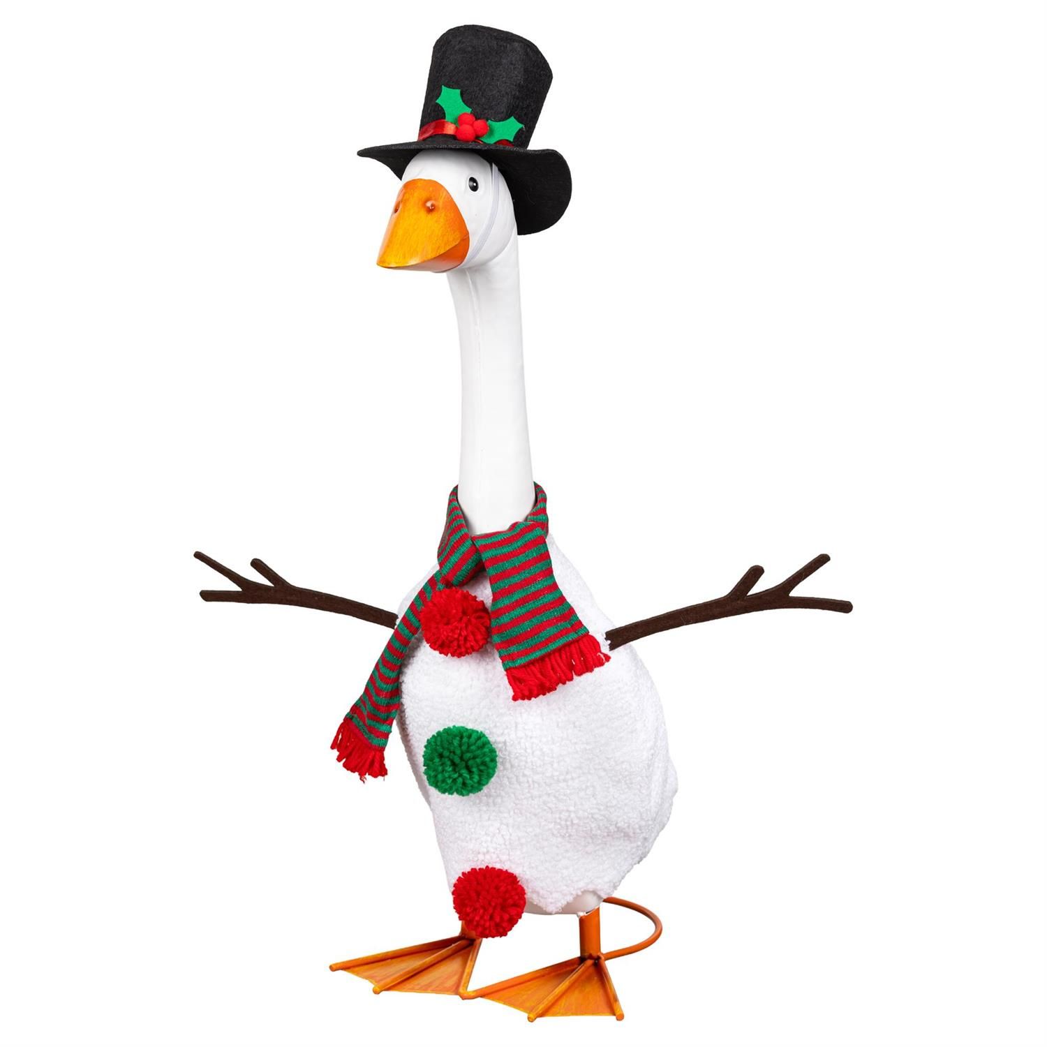 Giddy the Porch Goose in a snowman costume with branch-shaped arms, red and green pom-pom buttons, a striped scarf, and top h
