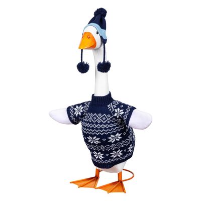 Giddy the Porch Goose wearing a navy sweater with white snowflakes and a blue hat with three pom-poms.