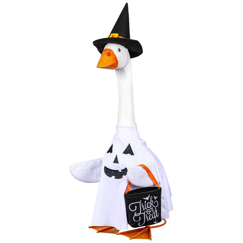Giddy the Porch Goose wearing a white ghost outfit with a smiling black face, pointed witch hat, and black Trick or Treat bag