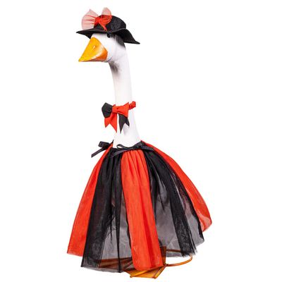 Giddy the Porch Goose wearing a sheer orange-and-black skirt, matching neck bow, and black hat with an orange bow.
