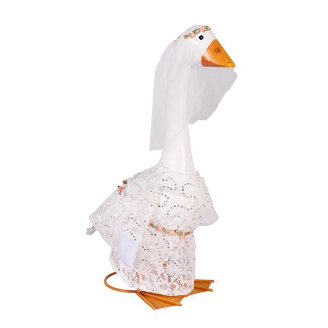 Giddy the Porch Goose wearing a white lace bridal gown with floral accents and a white veil topped with small flowers.