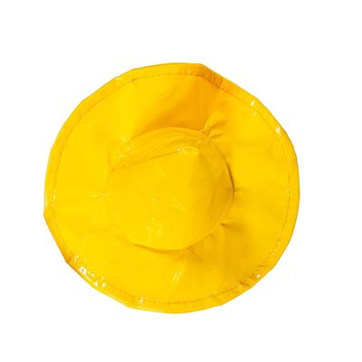 Close-up of the yellow porch goose rain hat showing its wide brim and glossy finish.