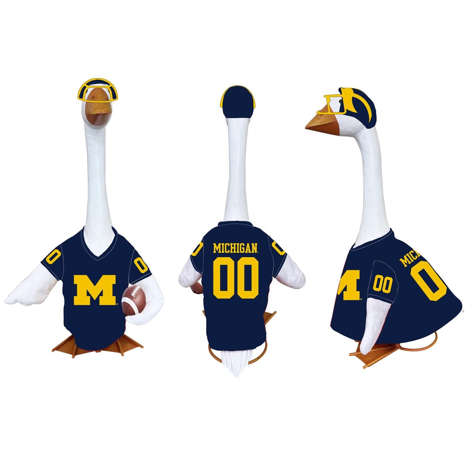 Front, back, and side views of a porch goose in a navy Michigan jersey with a maize block M, number 00, winged helmet, and
