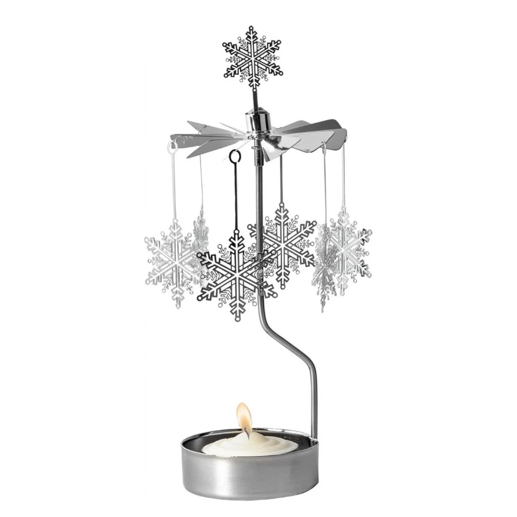 Silver Snowstar rotary candleholder with hanging snowflakes, a snowflake topper, and a lit tealight.