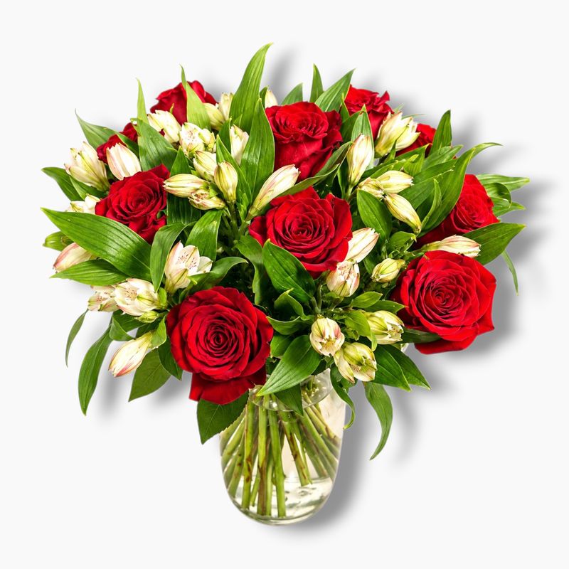 Bouquet in a vase of roses and alstroemeria.