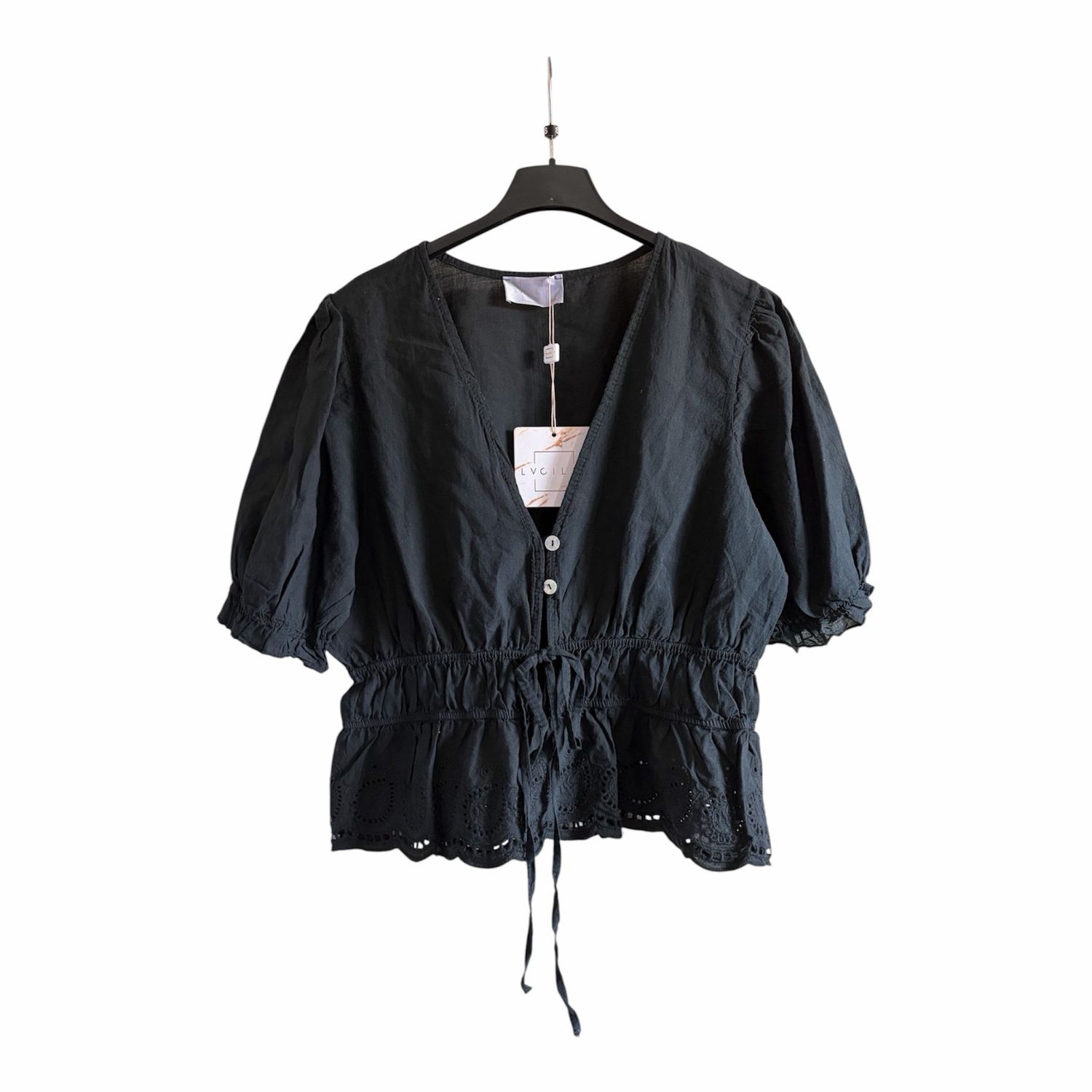 V-hals blouse met broderie en strikdetail