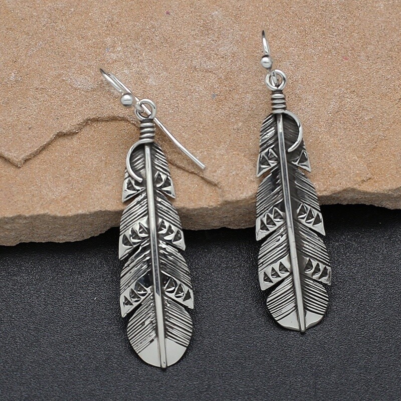Medium sized dangle feather earrings