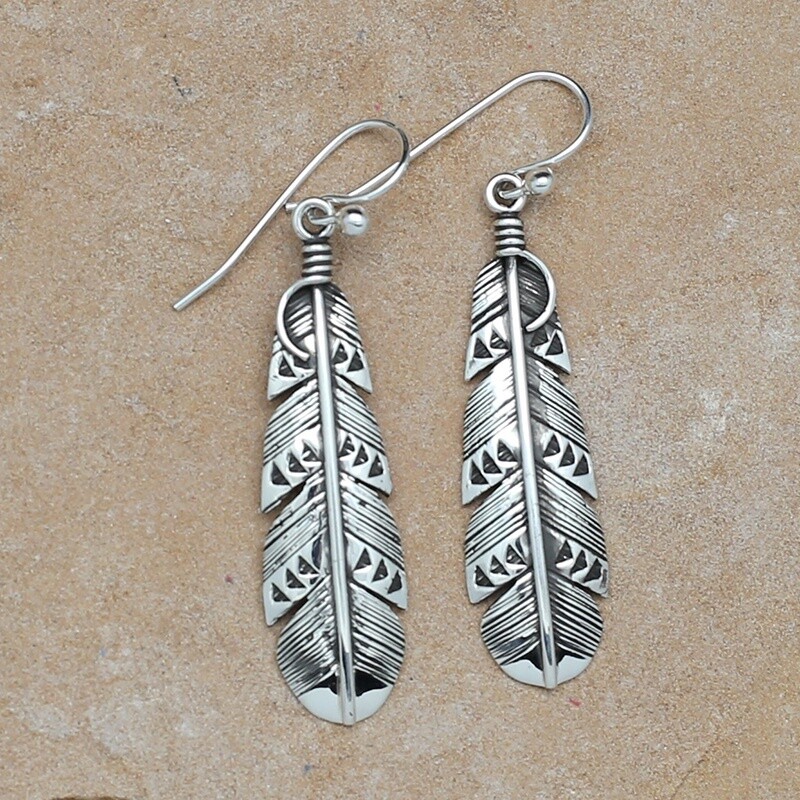 Medium sized dangle feather earrings