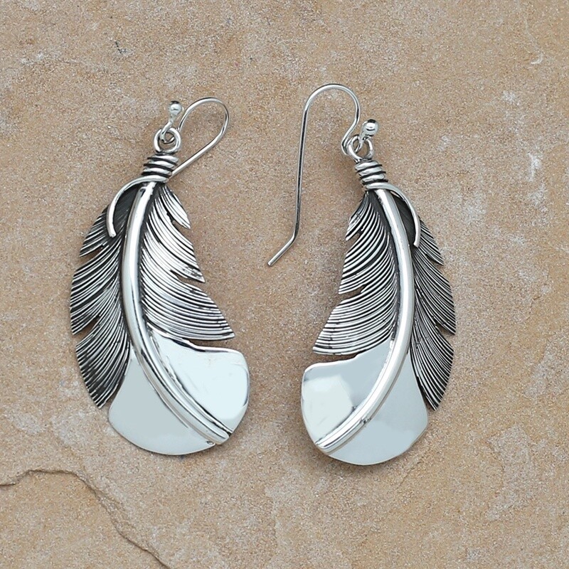 Large curved feather earrings