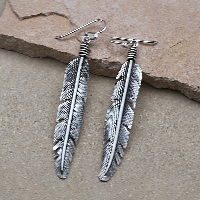 Detailed eagle feather earrings