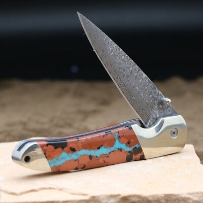 Damascus folding knife with boulder turquoise inlay